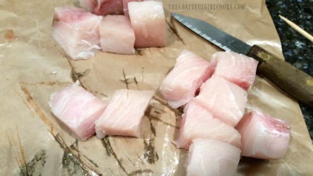 Swordfish steak cut into cubes for kabobs.