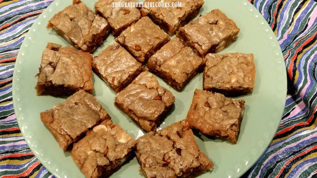 Triple chip bar cookies are served on a light green plate.