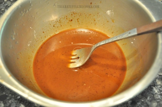 Asian sauce is mixed in bowl for Kung Pao Zoodles.