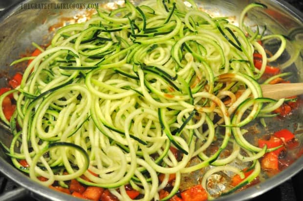 Zucchini noodles (zoodles) are added to skillet.