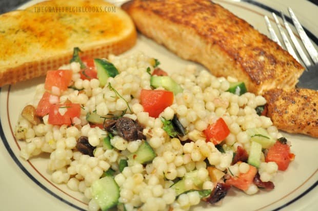 Lemon herb couscous salad is served with Creole salmon and garlic bread.