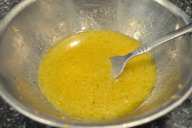 The salad dressing is mixed together for lemon herb couscous salad.