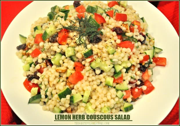 Lemon Herb Couscous Salad, w/ cucumbers, raisins, toasted pecans, dried cranberries, fresh herbs, tossed in a light lemon dressing is an easy, tasty side dish!