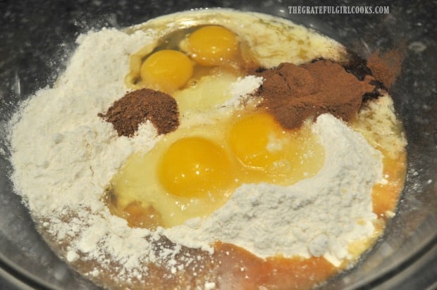 Ingredients for apple cider bundt cake batter are placed in large bowl to mix.