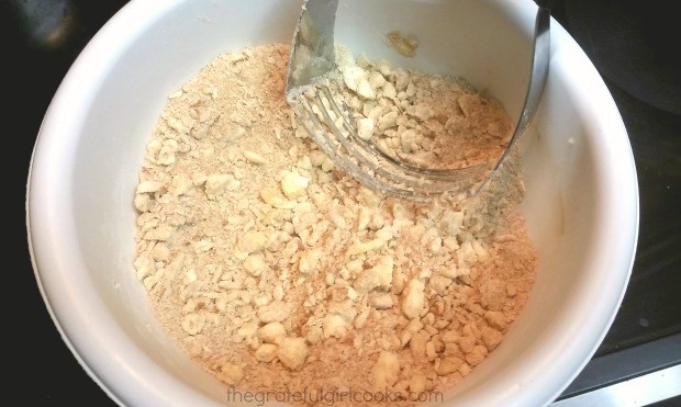 Preparing the streusel topping for the peach galette.