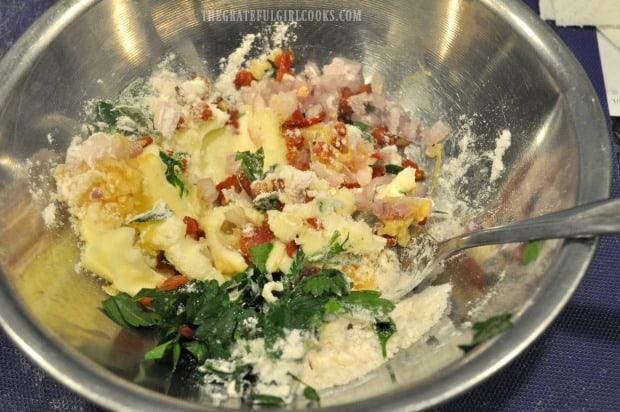 Mixing up the garlic bacon butter seasoning for roast cod, in small bowl.