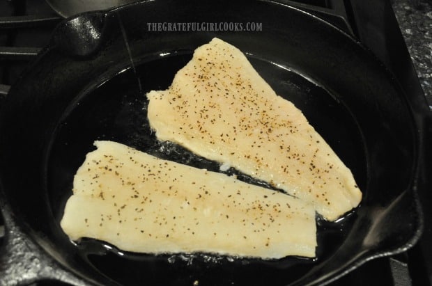 Cod is pan-seared to a golden brown in skillet, before roasting in oven.