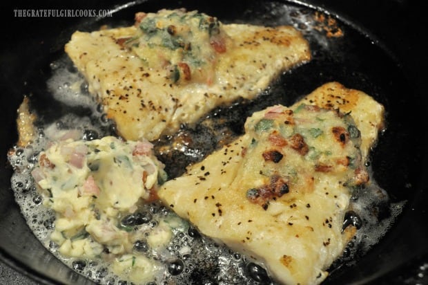 Garlic bacon butter is added to skillet to melt, so it can be drizzled on roast cod.