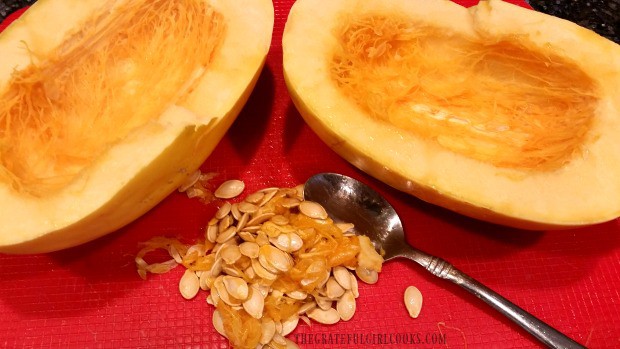 Seeds and pulp are removed from the spaghetti squash.