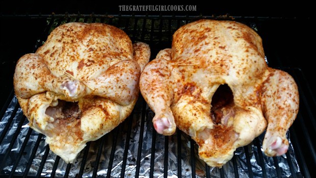 Traeger roasted chicken, on the grill cooking.