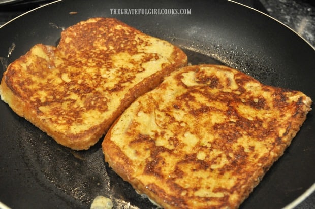 Classic french toast is cooked until lightly browned on both sides in skillet.