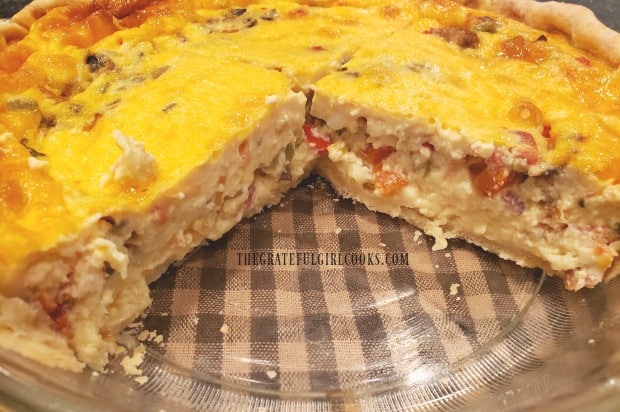 Southwestern bacon quiche with a couple slices taken out of it.