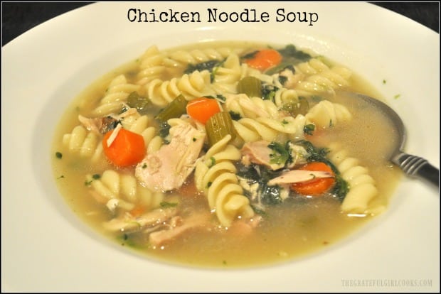 Delicious, homemade chicken noodle soup, with leftover rotisserie chicken, celery, carrots, garlic, onions and spinach will warm you up on a cold day!