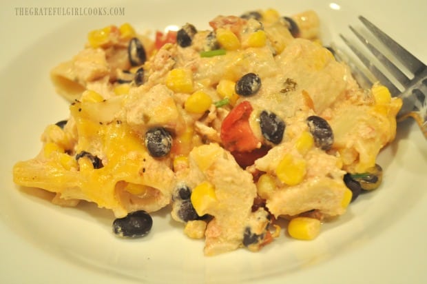 An individual portion of fiesta chicken pasta casserole is served in a white bowl.