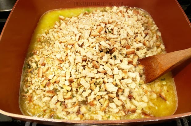 Two boxes of stuffing mix are stirred into the veggies and broth for easy cornbread stuffing.