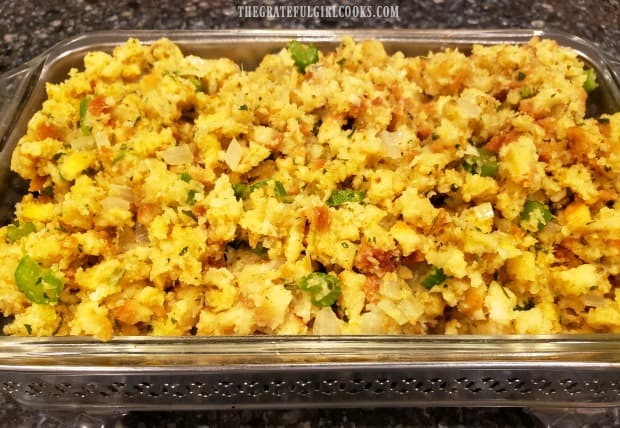 Easy cornbread stuffing is transferred to a serving dish.