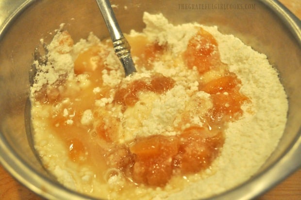 Mixing apple pie filling into the batter for apple pie pancakes.