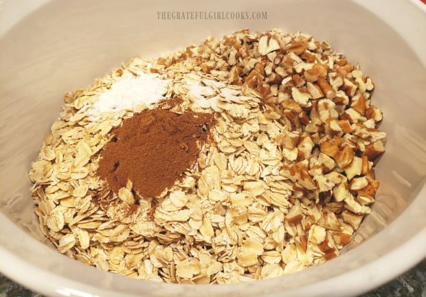 Oats, chopped pecans and spices are mixed together for blueberry baked oatmeal.