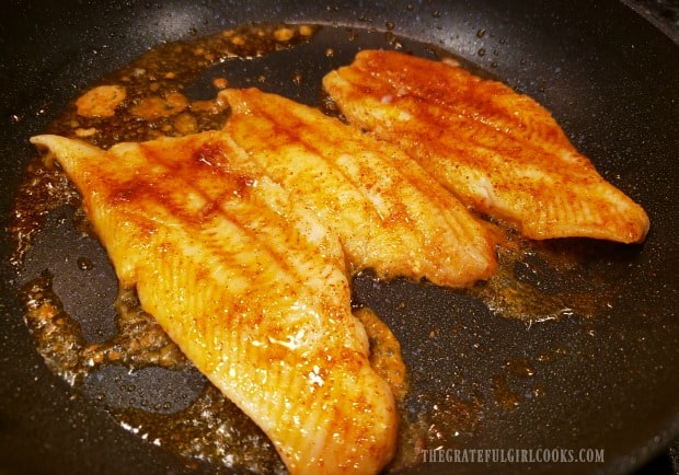 Dover sole fillets are carefully turned over to cook the other side, once browned.