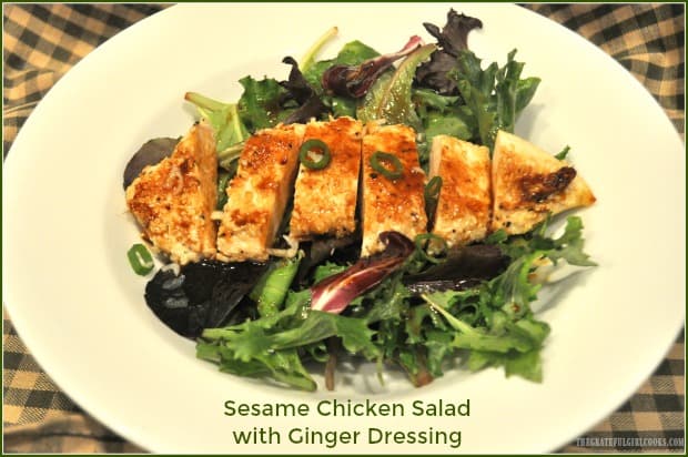 Delicious Asian-inspired Sesame Chicken Salad features pan seared sesame crusted chicken breasts, on spring greens, topped w/ a ginger salad dressing!