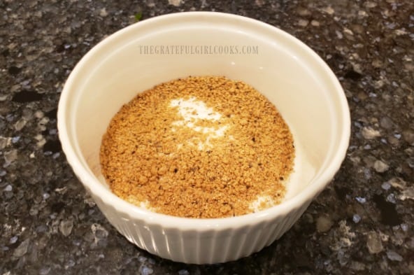 Spice rub mixture in bowl, ready to season broiled salmon.