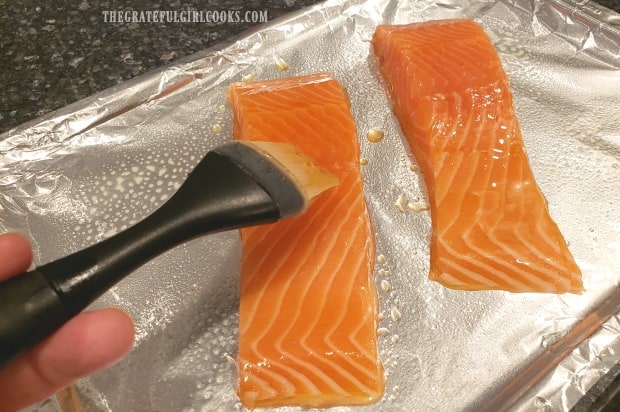 Honey and water glaze is brushed onto salmon before broiling.