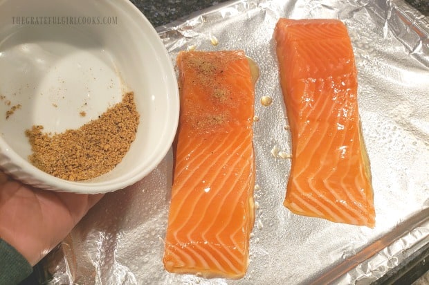 The broiled salmon recipe calls for sprinkling fillets with spice mix before broiling.