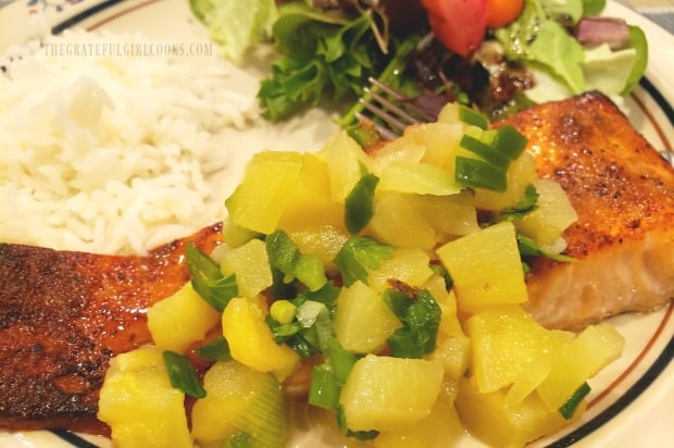 Close up photo of the pineapple salsa on top of the seasoned broiled salmon.