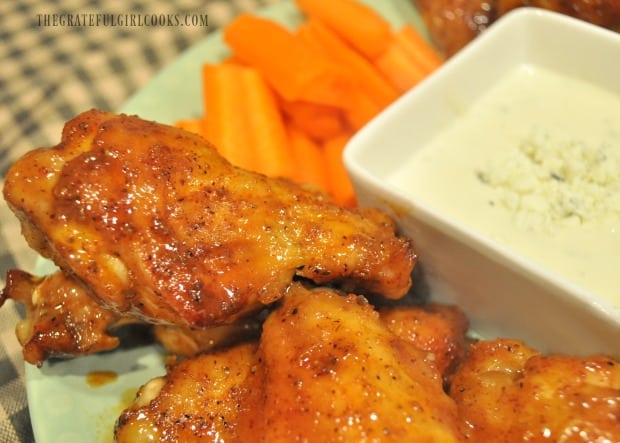 Here's a close up of the buffalo honey hot wings on plate, with bleu cheese dressing and carrots on the side.