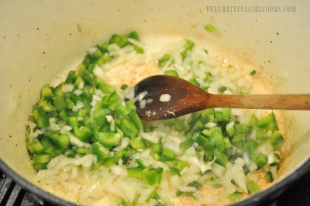 Bell peppers, jalapeño and onions are cooked, to add to Southwestern chicken soup.