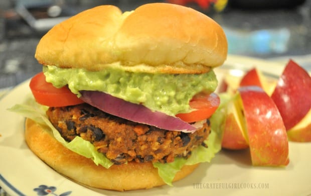One of the black bean burgers, served on bun with tomato, red onion, lettuce and guacamole!