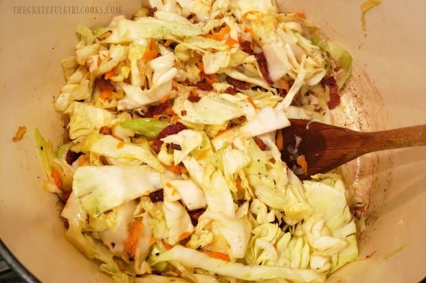 The fried cabbage ingredients are combined, then cooked until tender.
