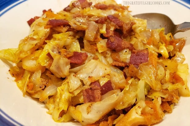 Fried cabbage, with bacon, onions, carrots and garlic is served as a side dish.