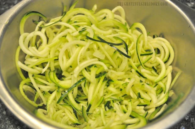 Spiralized zucchini noodles are ready to add to the Thai turkey meatballs and sauce.