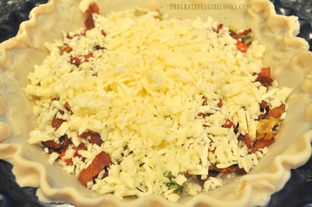 Grated mozzarella and Swiss cheeses are added to the bacon broccoli quiche.