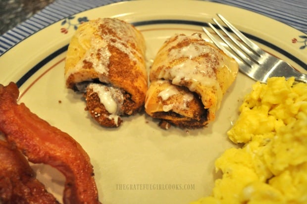 The cinnamon roll crescents were served along with scrambled eggs and bacon.