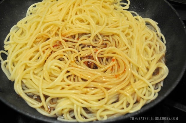 An Asian sweet chili sauce is added to the drained, cooked pasta.