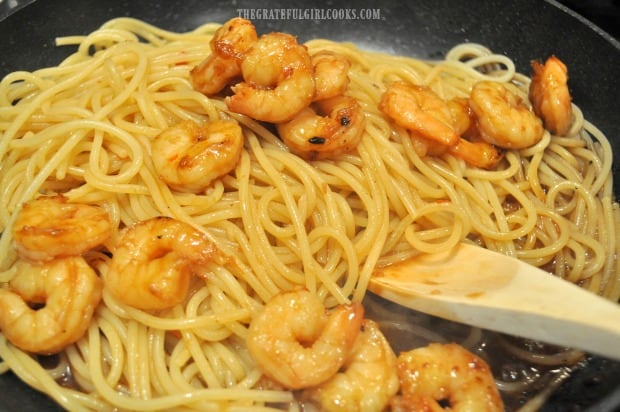 Marinated shrimp are added to the skillet with the sweet chili sauce and pasta.