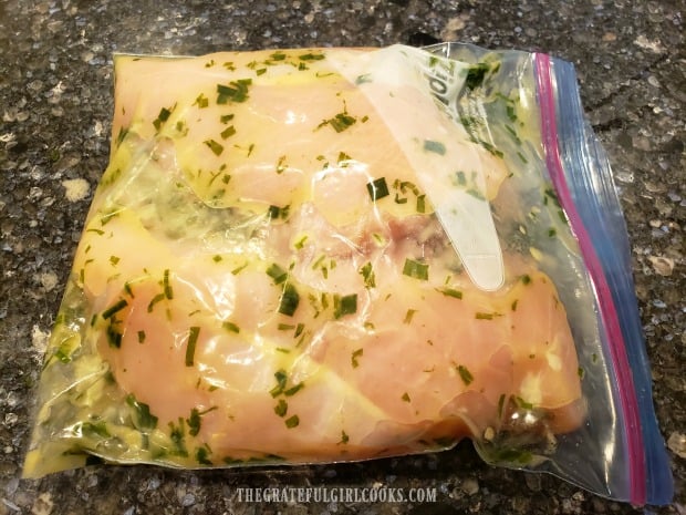 The chicken pieces are coated with the marinade, then refrigerated.