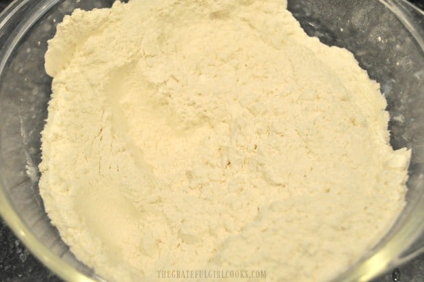 Flour, baking powder, salt and baking soda are mixed to add to the cake batter.