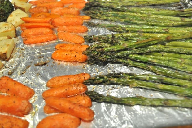 The oven roasted carrots and asparagus are finished cooking and are ready to serve.