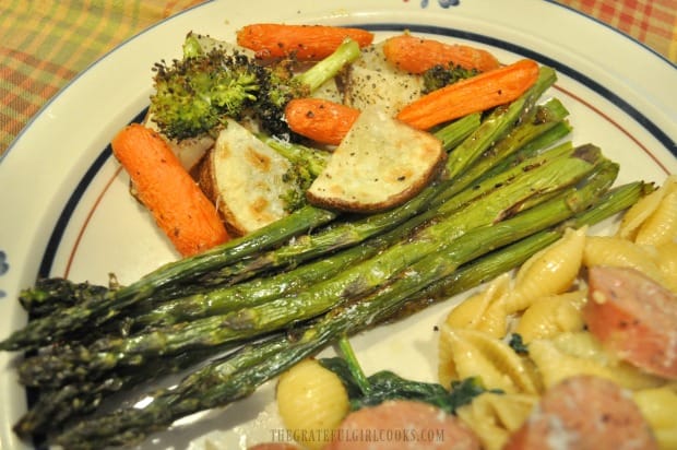 An overhead view of some of the oven roasted veggies on a dinner plate.