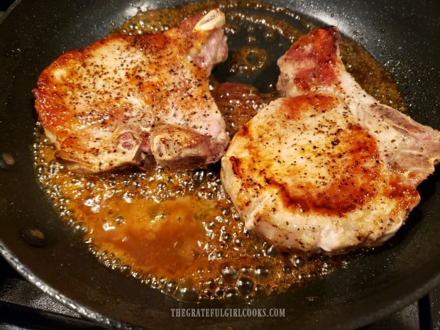 Skillet Glazed Pork Chops finish cooking in the thickened glaze.