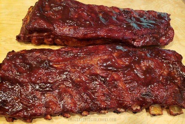 BBQ Baby Back Ribs are finished cooking, and rest on cutting board for 5 minutes.