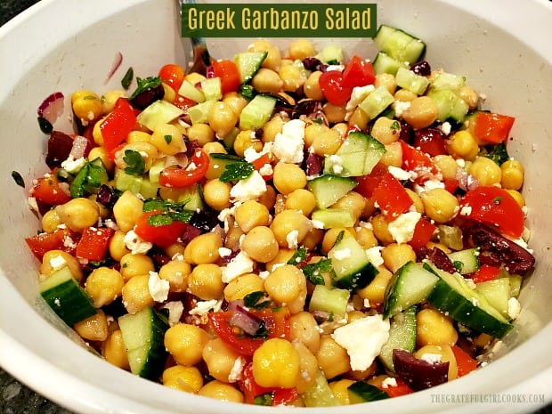 Delicious Greek garbanzo salad, with kalamata olives, feta cheese, cucumbers, peppers & light dressing, is vegetarian, gluten-free, and super easy!