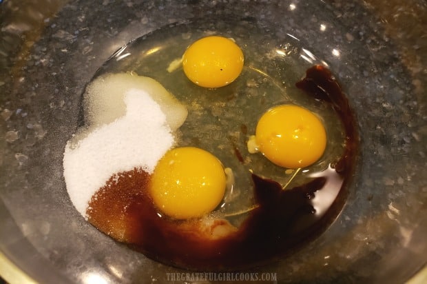 Eggs, vanilla extract and sugar substitute are mixed together in a bowl.