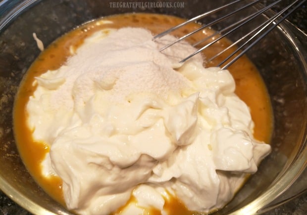 Non fat, plain Greek yogurt and sugar free cheesecake mix are added to the egg mixture in bowl.