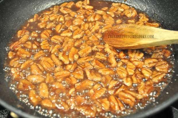 Pecans are cooked in water, brown sugar and cinnamon to candy them for salad.