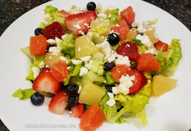 Fruit Feta Green Salad with candied pecans is ready for poppyseed dressing.