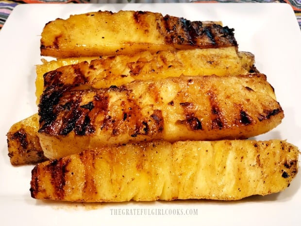 A serving plate with the warm grilled pineapple spears, ready to eat!